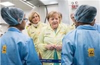Dr Merkel seen speaking to staffers at the Manesar plant. 