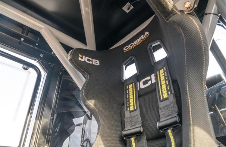 FIA-approved Cobra motorsport seat is straight racing-car specification and fitted with a five-point racing harness. Even with a helmet on, though, there’s ample head room beneath the roll-cage.
