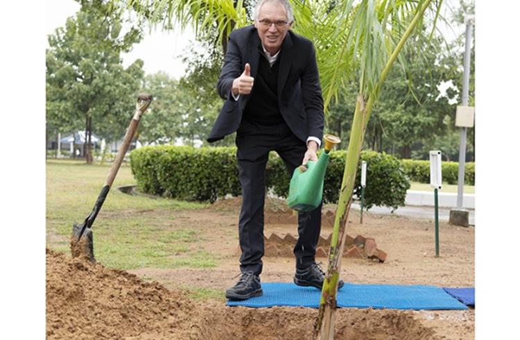 Stellantis CEO Carlos Tavares plants a tree at the Thiruvallur facility on the outskirts of Chennai, on November 23, 2022.