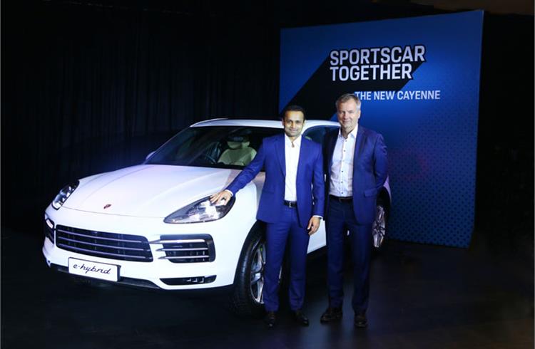 L-R: Pavan Shetty, director of Porsche India and Peter Vogel, acting CEO and Sales Director of Porsche Middle East & Africa FZE, with the new Cayenne E-Hybrid in Mumbai.