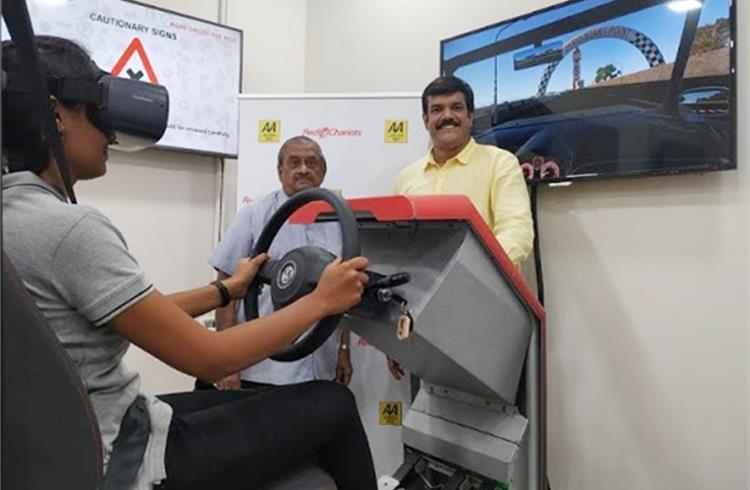 L-R: T D Sadasivam, Chairman, Automobile Association of Southern India (AASI) and DV Vinod Gopal, Director, Red Chariots Technologies and a trainee at the driving simulator.