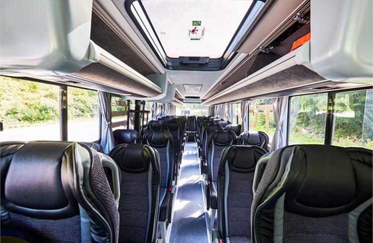 Premium seating arrangement in the buses with storage space above the seat, similar to flights. 