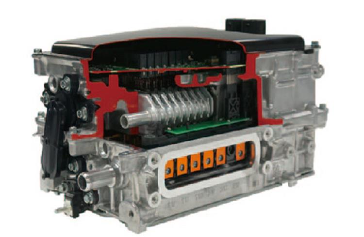 A Power control unit from Denso that consists of inverters and boost converter, which control and converts the current between the battery and the motors.