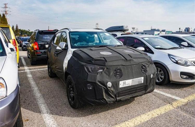 Heavily disguised test mule of India-bound compact SUV was snapped on a test run in Korea.