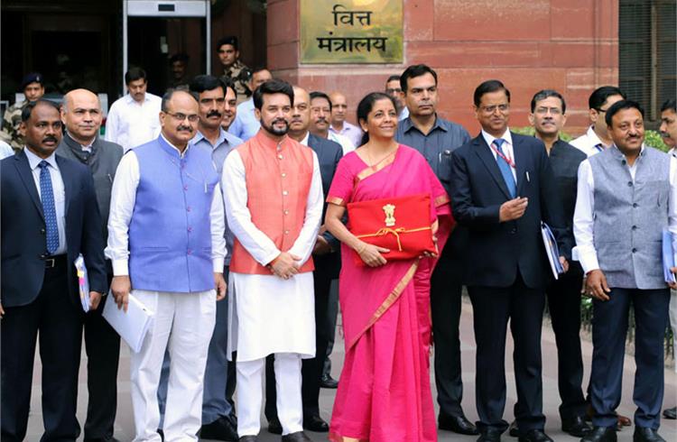 The Union Minister for Finance and Corporate Affairs, Nirmala Sitharaman departs from North Block to Rashtrapati Bhavan and Parliament House. (Image: PIB)