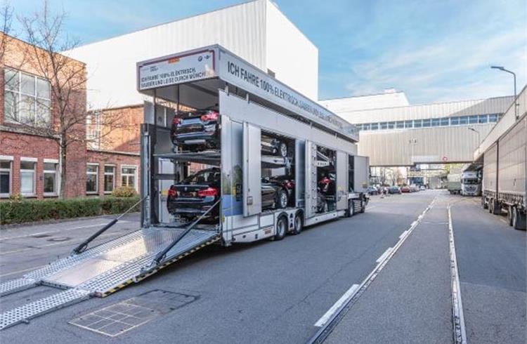 The electric truck loading new vehicles at BMW Group Plant Munich.