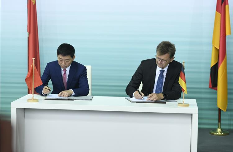 L-R: Wei Jianjun, founder and chairman of Great Wall Motor, and Klaus Frohlich, member of the board of management of BMW development