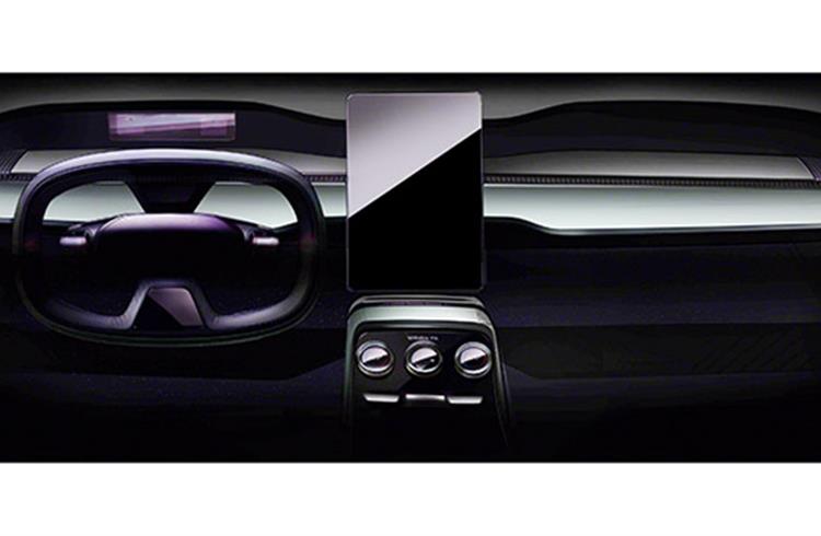 New sketch reveals a flat, wide instrument panel, which extends to the doors, emphasising the width of interior. A large, free-standing touchscreen, which is arranged vertically is a first for Skoda.