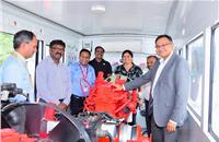 R-L: Ashwath Ram, MD, Cummins India; Anjali Pandey, VP (Engine Business and Component Business), Cummins India and a team of service engineers inside the training van.