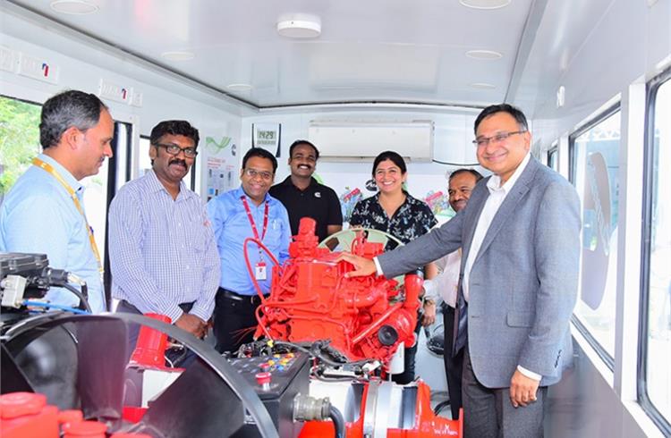 R-L: Ashwath Ram, MD, Cummins India; Anjali Pandey, VP (Engine Business and Component Business), Cummins India and a team of service engineers inside the training van.