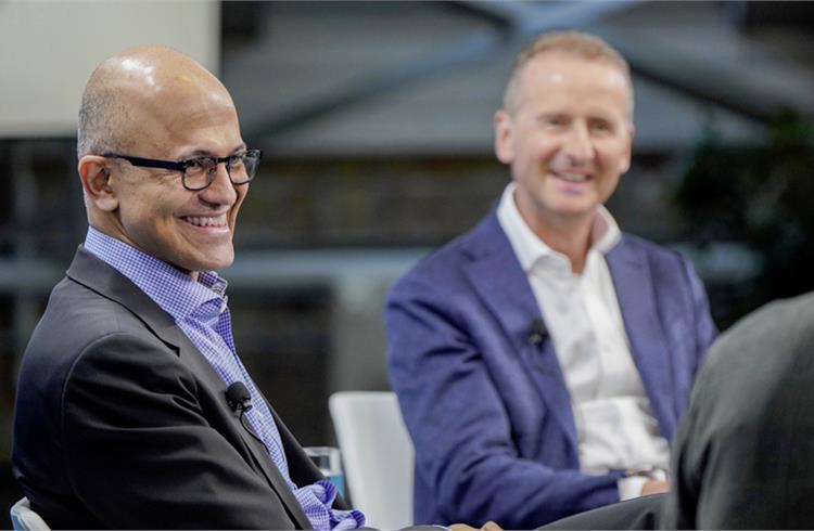 Satya Nadella, CEO of Microsoft (middle) with Dr. Herbert Diess, CEO of Volkswagen AG (right)