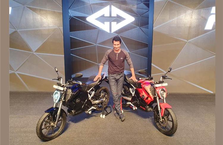 Rahul sharma with the newly unveiled RV 400 electric bikes from Revolt motors