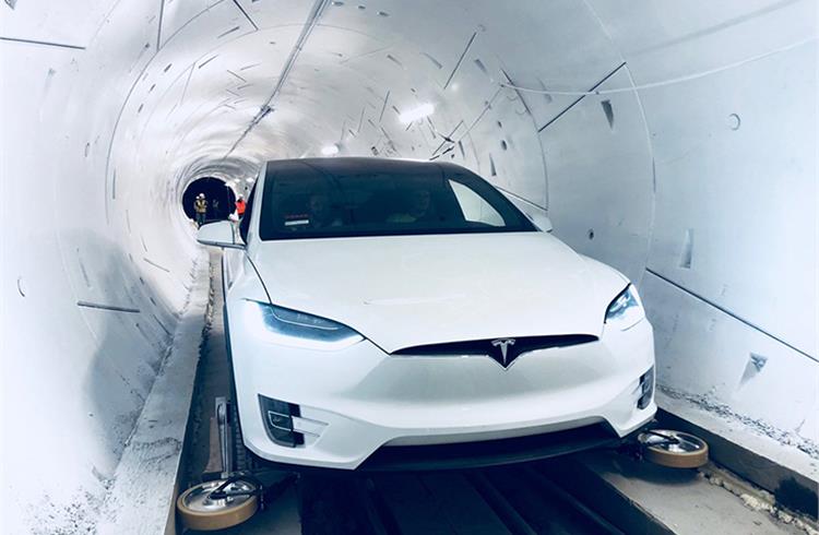 Tesla's Boring company showcases retractable wheel gear that turns a car into a rail-guided train & back again inside the loop tunnel for the EVs
