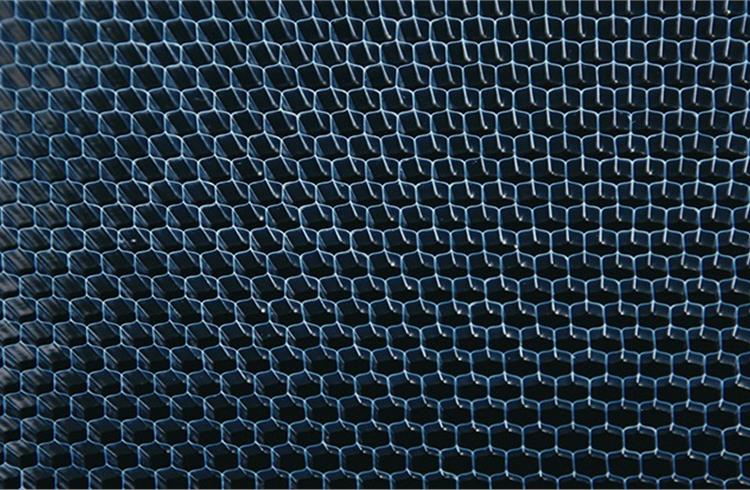Nissan’s acoustic meta-material is one-fourth the weight of heavy rubber board yet provides the same degree of sound isolation.