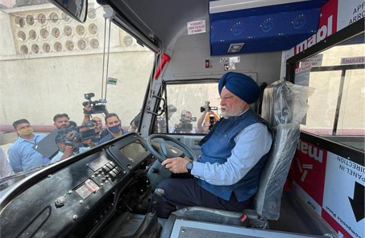 Union Minister of Petroleum & Natural Gas, Hardeep Singh Puri gets a feel of a school bus at the SIAM-organised CNG & LNG-based Clean Technology Vehicles exhibition. (Image: Hardeep Singh Puri/Twitter)
