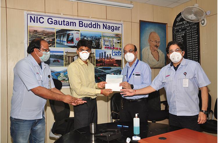 Suhas Lalinakere Yathiraj, District Magistrate, Gautam Buddh Nagar, Uttar Pradesh receiving a cheque of Rs 25 lakhs from Sanjiv Paul, Senior Vice President and  Vimal Raina, VP, India Yamaha Motor