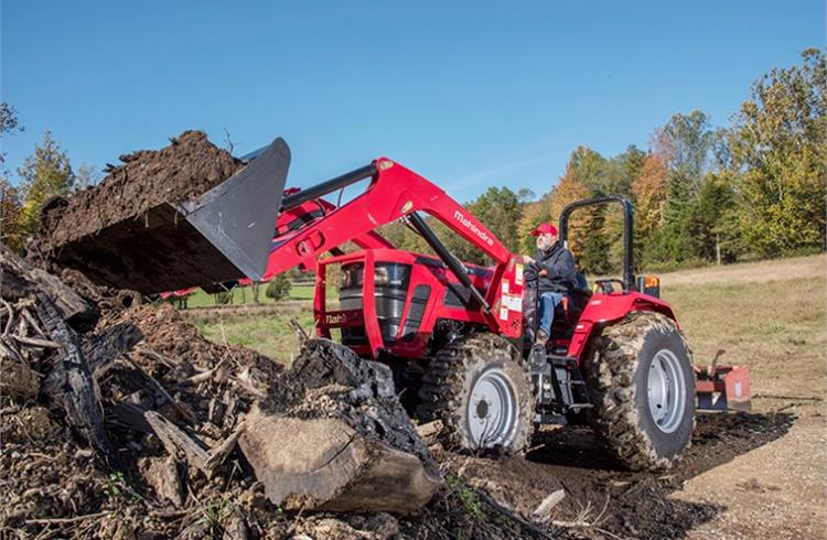 Stewart HAAS Racing team co-owner Tony Stewart with a Mahindra tractor.