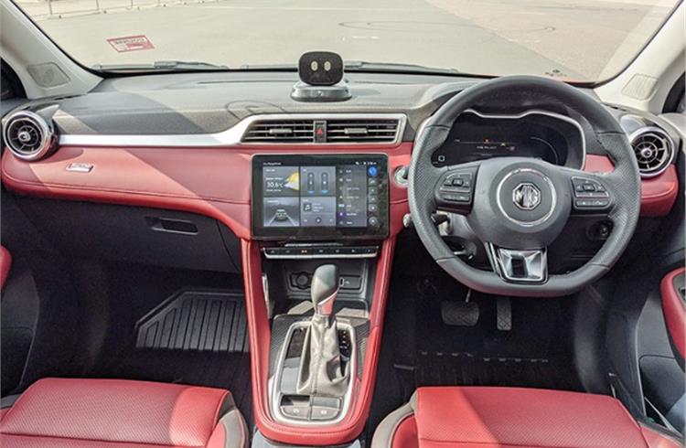 Astor gets a premium interior with multiple colour options and generous use of soft-touch materials. AI assistant robot placed atop dashboard is a first in segment.