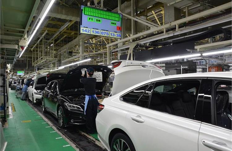 Toyota cuts global production