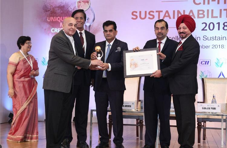 S. Devarajan, senior VP, TVS Motor Company; Swaran Singh, CEO, Srinivasan Services Trust and Ashoke Joshi, Advisor SST, receiving the award. 