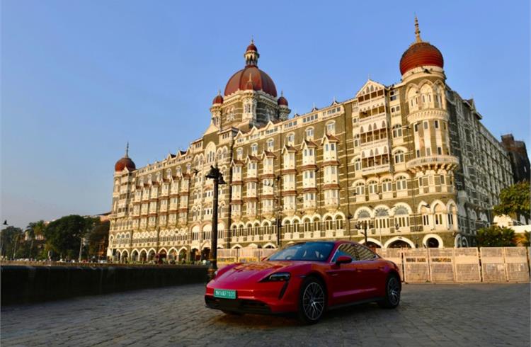 Taycan in front of the historic Taj Mahal Palace in Mumbai. A record 113 units were sold in India last year.