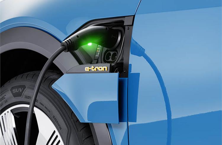 The Audi e-tron's electric charging flap integrates a connection for AC and DC charging. A steady green light means charging is complete.