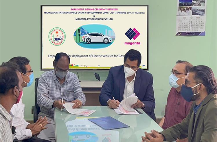 Magenta Power management and TSREDCO officials sign the agreement for deployment of electric vehicles in state departments. 