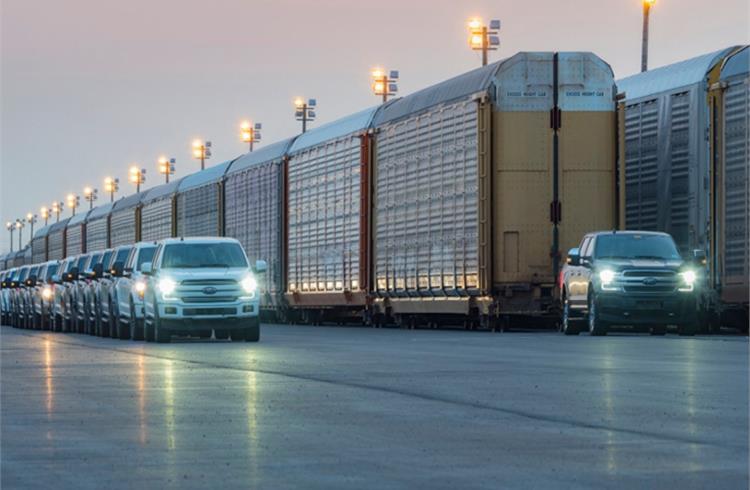 Ford’s prototype all-electric F-150 tows 10 double-decker rail cars and 42 2019-model year F-150s, weighing more than 1 million pounds for 1,000 feet