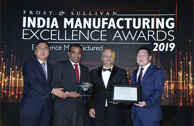 HMIL officials receiving the 'Indian Manufacturer of the Year - 2019' and 'Smart Factory Award' at IMEA
