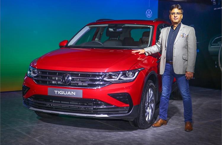 Ashish Gupta, Brand Director, Volkswagen Passenger Cars India with the locally assembled Tiguan five-seater SUV. 