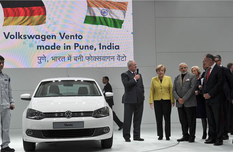 Prof. Dr. Martin Winterkorn, CEO of Volkswagen, with prime minister N Modi and chancellor A Merkel at the VW stand.
