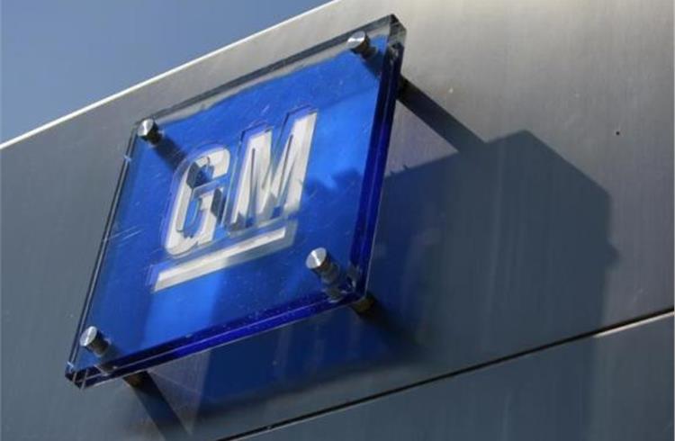 The General Motors logo is seen outside its headquarters at the Renaissance Center in Detroit, Michigan.