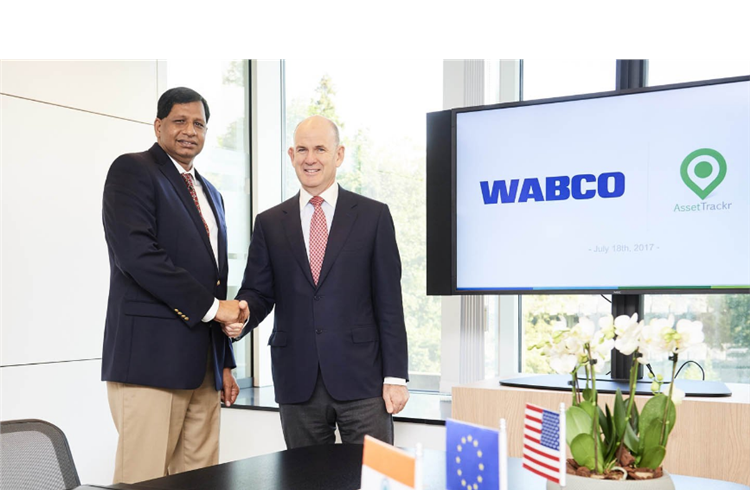 Jacques Esculier, Wabco chairman and CEO (right) and Ashok Yerneni, AssetTrackr founder and CEO, following the signing ceremony in Brussels, Belgium.