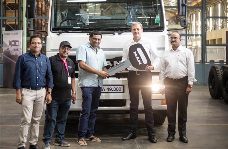 Joerg Mommertz, chairman and MD, MAN Trucks India, handing over the key of the new CLA EVO truck to V Ravikant of Manohara Green Logistics,Rajahmundry.