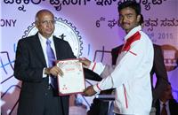 Chief guest Subramanian Ramadorai gives away a certificate to a successful student at TTTI.