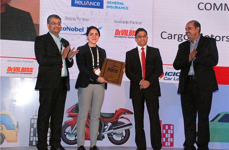Prakash Rao, Ian Saldhanah and Ravi Narayanan present the award for the Commercial Dealer of the Year to Cargo Motors.