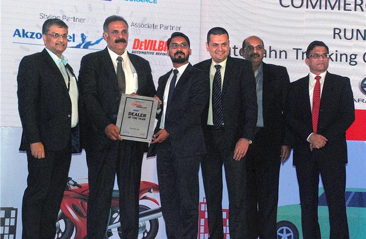 Prakash Rao, Ian Saldhanah and Ravi Narayanan present the award for the Commercial Dealer of the Year Runner up to Autobahn Trucking Corp.