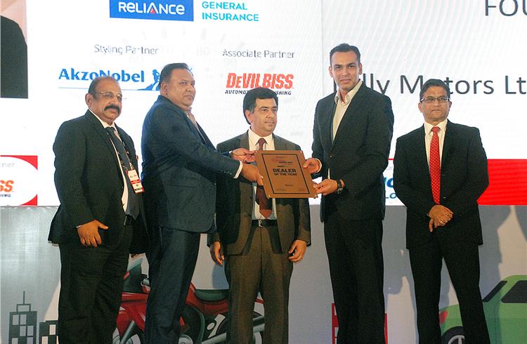 John Paul, Ravi Narayanan and Hormazd Sorabjee present Lally Motors the runner-up award for the Dealer of the Year (Four-wheeler).