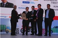 Nikunj Sanghi, Sachin Shilawat, Prasanth Chandrashekharan present the runner-up award for the Dealer of the Year to V J Honda.