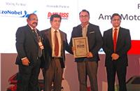 John Paul, Ravi Narayanan and Hormazd Sorabjee present the runner-up award for the Dealer of the Year (Four Wheelers) to Amit Motors.
