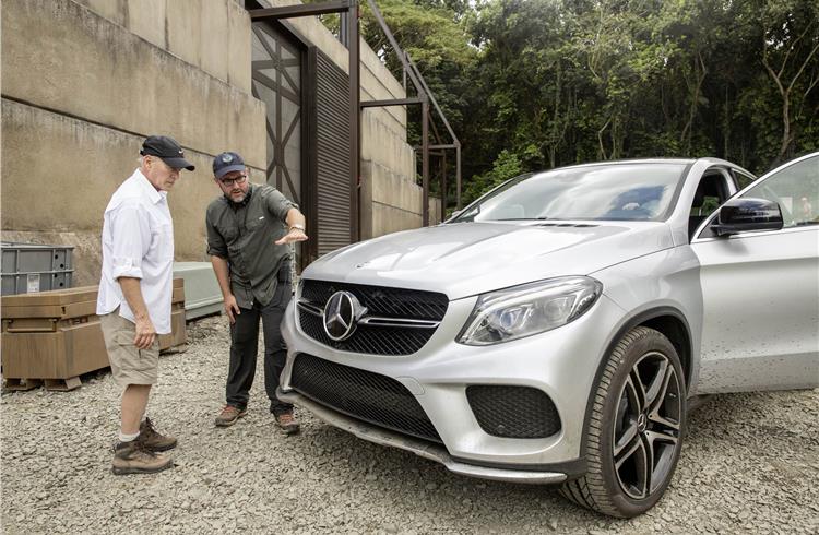 Producer Frank Marshall (left) and director Colin Trevorrow (right) preparing for filming the all-new Mercedes-Benz GLE Coupé on the set of Jurassic World.