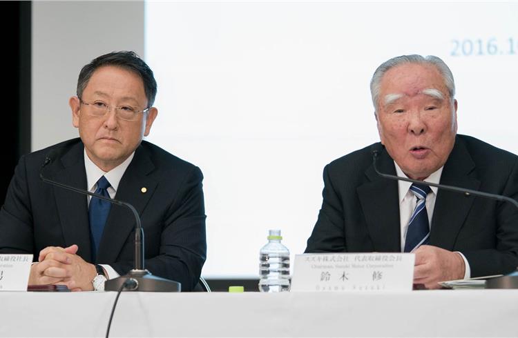 Toyota's president Akio Toyoda and Osamu Suzuki, chairman of Suzuki Motor Corporation.