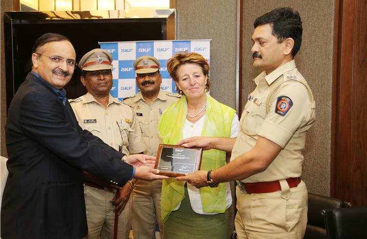 Shishir Joshipura, MD and Country Head, SKF India, and Tina Astrom, director, SKF Group Brand Protection, handing over a plaque of appreciation to DCP Ganesh from Pune. Fake SKF bearings worth Rs 60 l