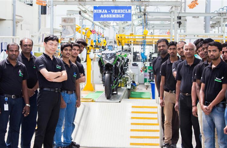 File photograph of the India Kawasaki India management team at the assembly line at Bajaj Auto's Akurdi plant.