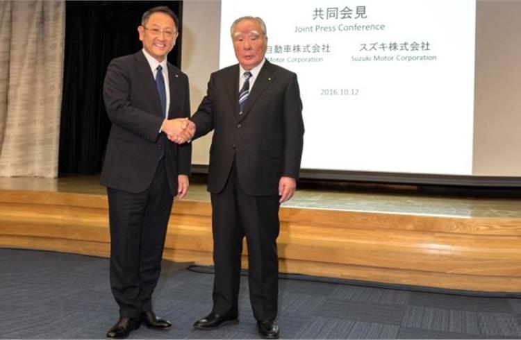 Toyota's president Akio Toyoda and Osamu Suzuki, chairman of Suzuki Motor Corporation at a media meet in Tokyo on October 12.