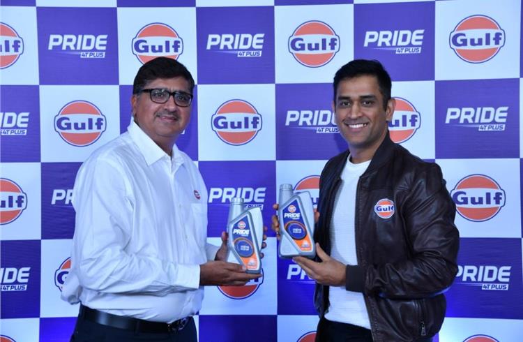 Ravi Chawla, MD, Gulf Oil Lubricants India, with MS Dhoni at the launch of the rebranded Gulf Pride 4T Plus engine oil in Mumbai.