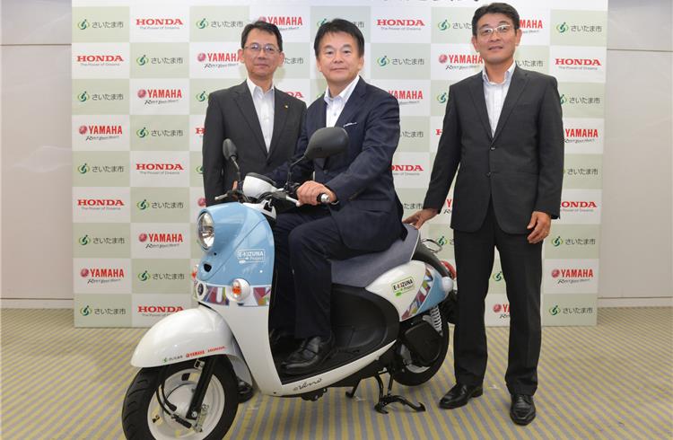 L-R: Katsuaki Watanabe, managing executive officer and director, Yamaha Motor Co; Hayato Shimizu, mayor of Saitama City, and Noriaki Abe, operating officer, Honda Motor Co.