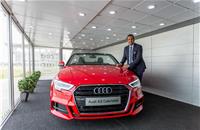 Audi India's Rahil Ansari with an A3 Cabriolet inside the mobile terminal.