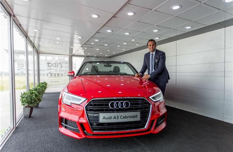 Audi India's Rahil Ansari with an A3 Cabriolet inside the mobile terminal.