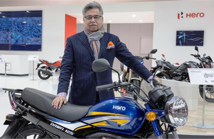 Pawan Munjal, CMD and CEO of Hero MotoCorp, with the 125cc Dawn at EICMA 2016.